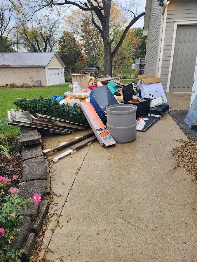 Dumpster being loaded with debris for 3 Yard Dumpster Rental in Charlestown